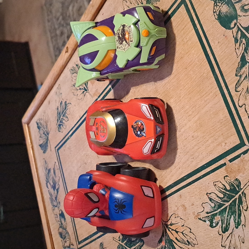 (2) friction cars: Green goblin and iron man and pull back spider man car